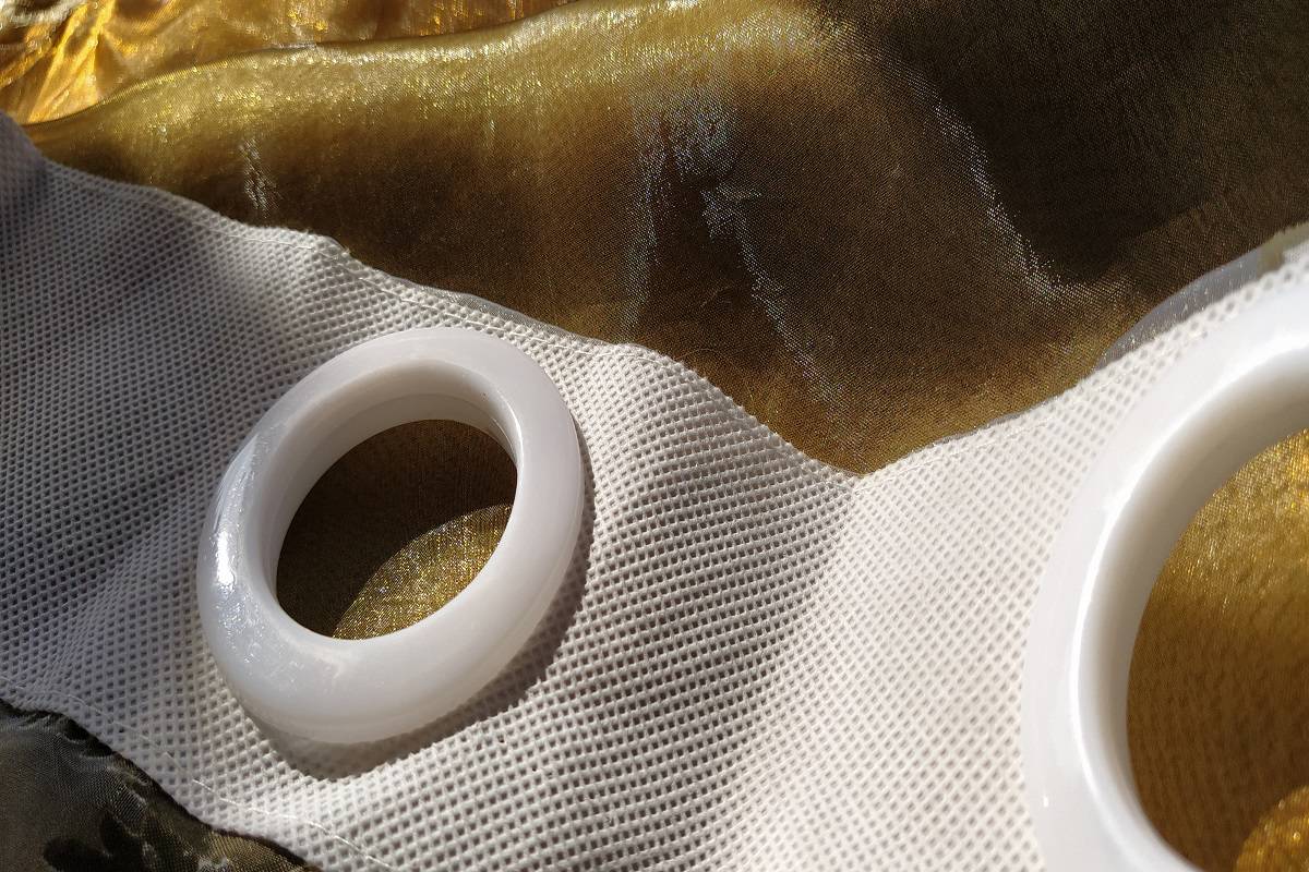  White plastic organza tulle eyelets. Light curtain in beige, brown or orange colors.