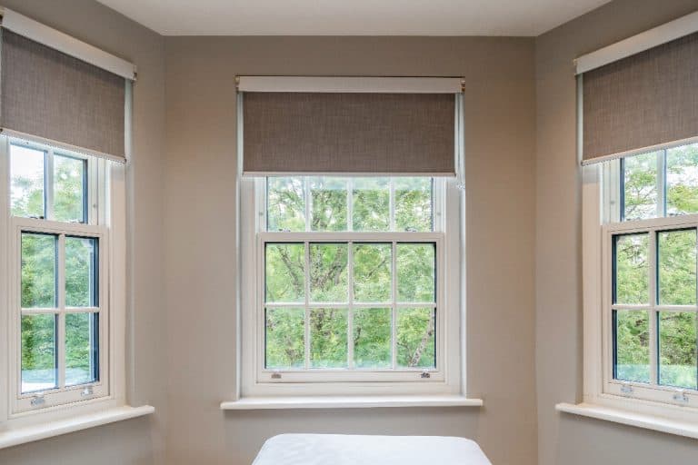 Pretty windows with blinds in a house, How To Hang Roller Blinds Without Drilling Holes?