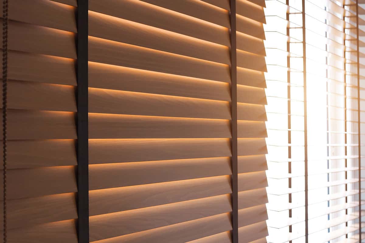 photo of a brown window blinds installed on the window of the living room