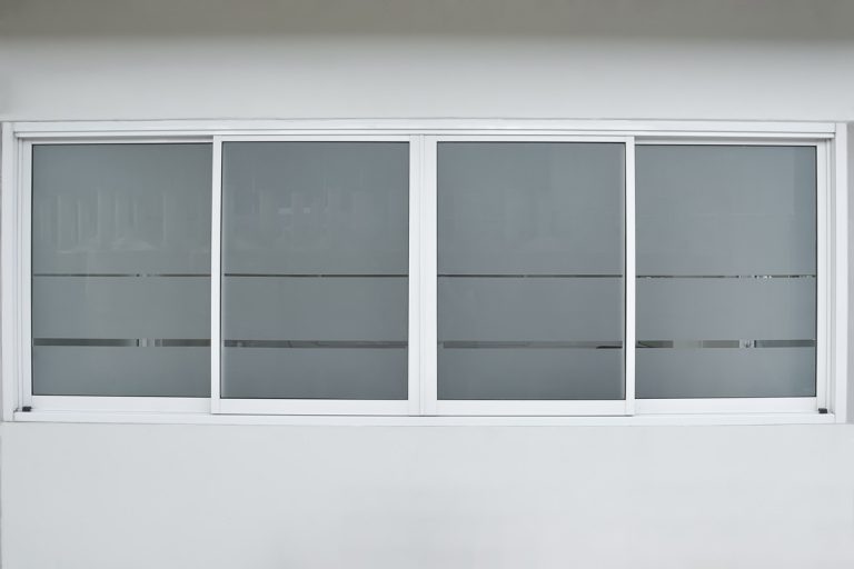 Aluminium sliding window of office. office sliding glass window. Decorative Glass Film on door of office. Closeup Frosted Glass Thick Film for reduced visibility across., Do Side Windows Have To Be Frosted?