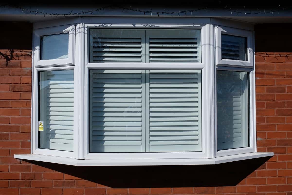 Benefits Of Shutters On Bay Windows - A bay window at the front of a house