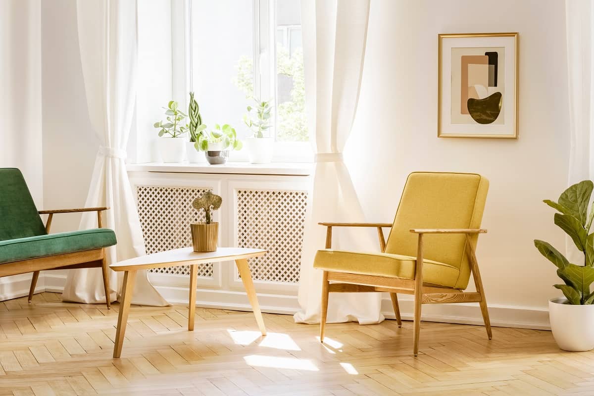 Can UV pass through sheer curtains - Yellow, retro armchair and a green sofa by a big, sunny window in a stylish,