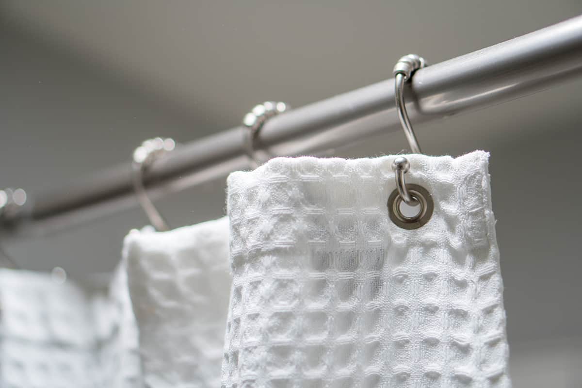 Decorative luxurious shower curtain on hooks