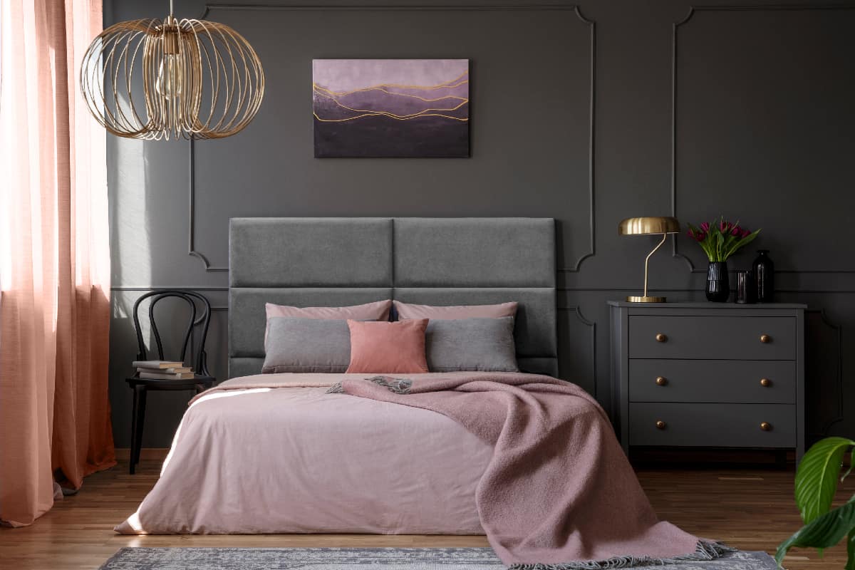 Elegant apartment interior for a woman with gray headboard