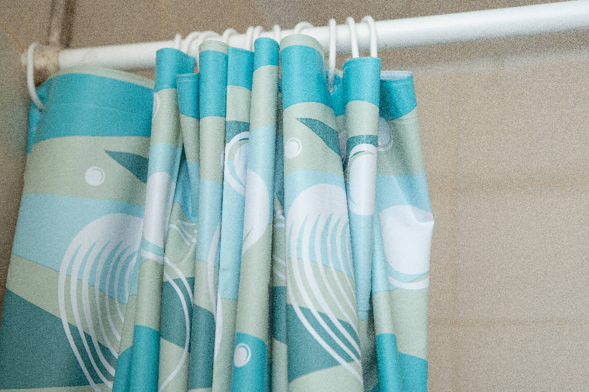 Front view blue bathroom Curtain with white rail in bathroom