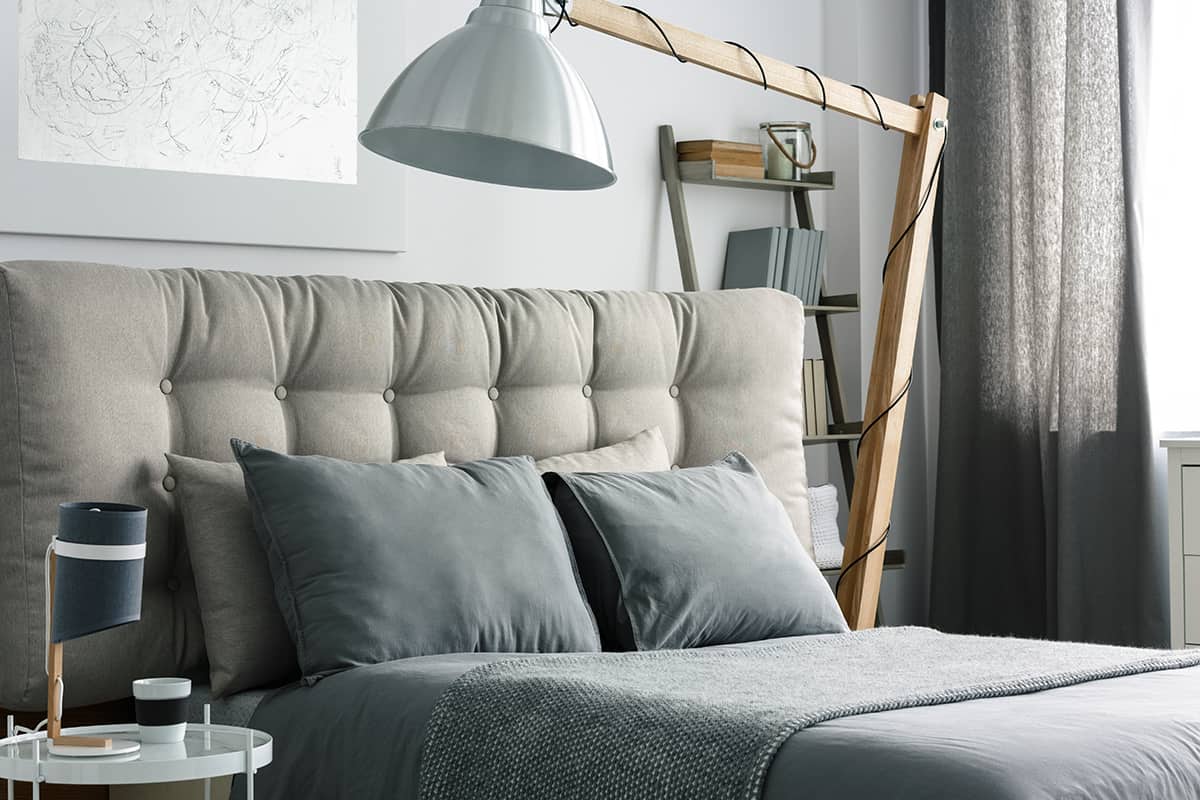 Grey bed with headboard