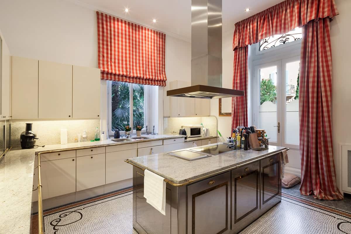 Hang Patterned or Printed Curtains - Interior of an old mansion, wide modern kitchen