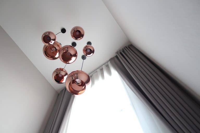 The beautiful lamps with copper colour hang on the high ceiling, How To Hang Curtains With 12 Foot Ceilings?
