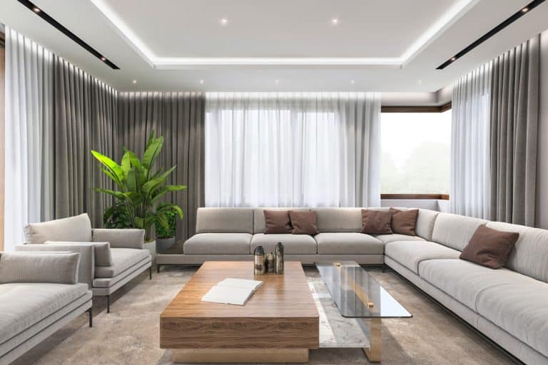 Modern villa interior, large sofa and armchairs, coffee table and lot of sunlight, What Curtains Are Best For Insulation?