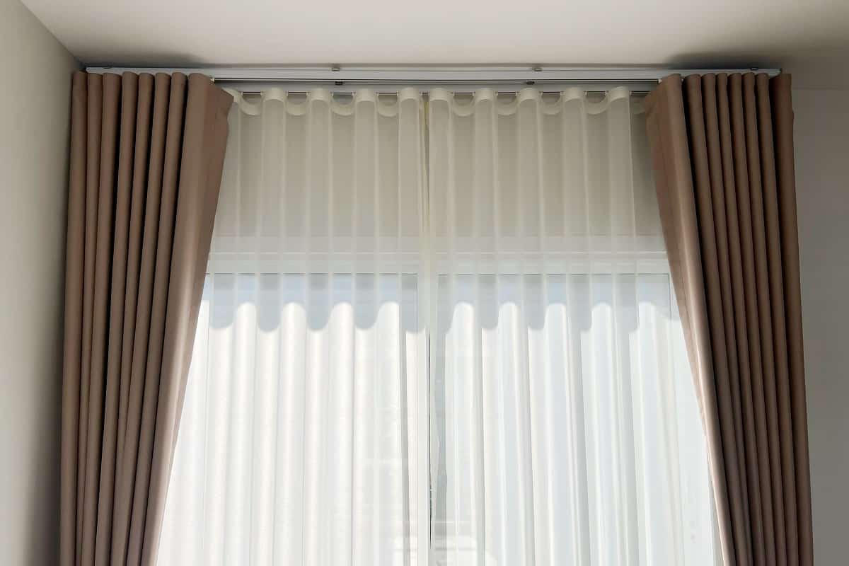 Sheers And Drapes - fabric curtain and white sheer curtains with translucent fabric hanging on door