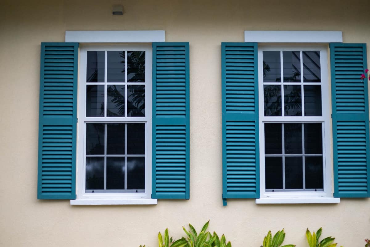 Two outdoor windows with outdoor window shutter