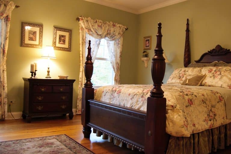 A victorian-style bedroom with a four poster bed and curtains, What Curtains Go With Florals [Inc. Bedding, Rug, And Wallpaper]?