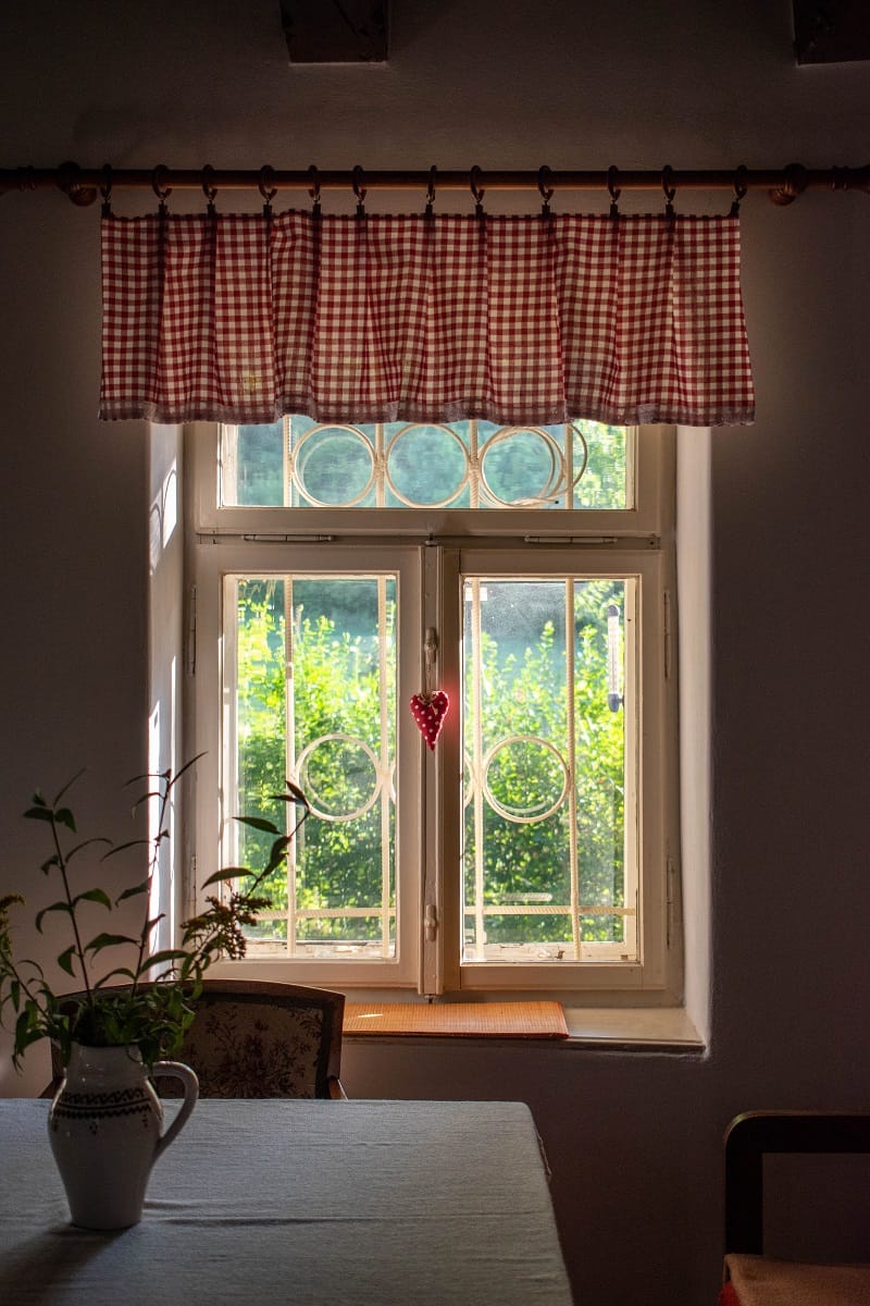 What is a Valance - Beautiful traditional cottage white wooden window with valance.