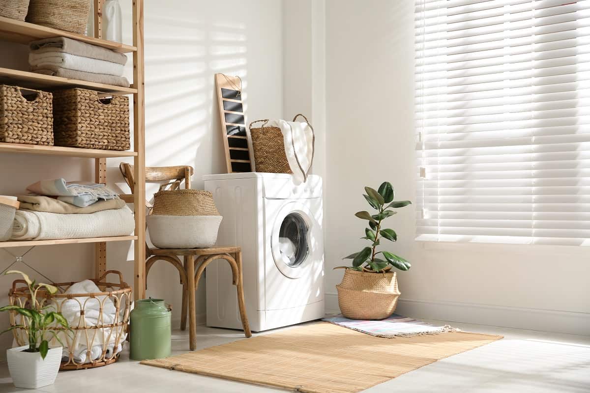 White Blinds - Modern washing machine and plants in laundry room interior