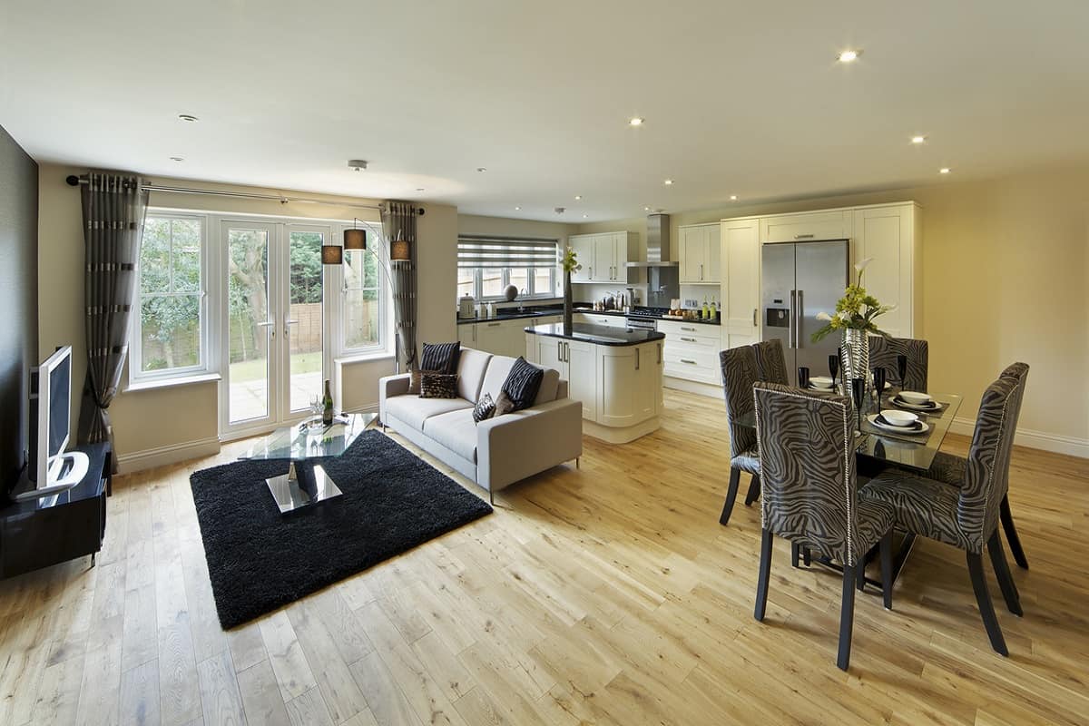 a spacious and bright room in a luxury new home with a farmhouse-style kitchen,
