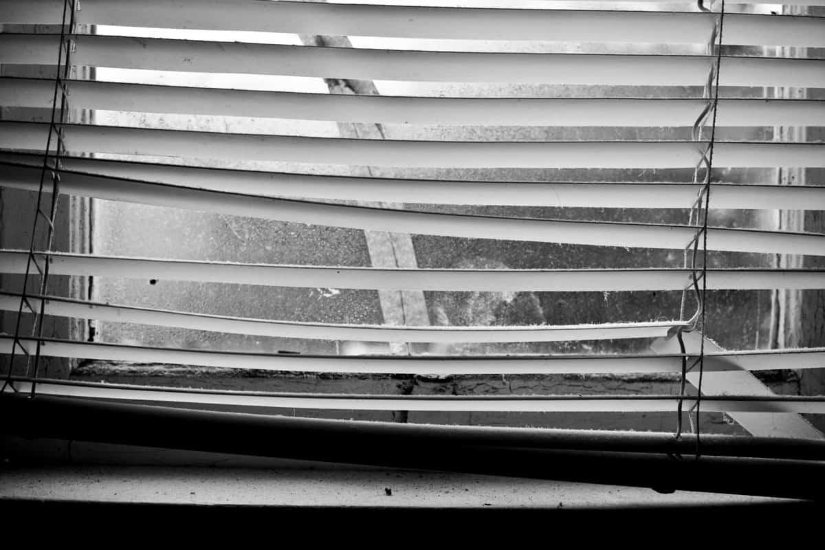photo of a window-shade broken window blinds