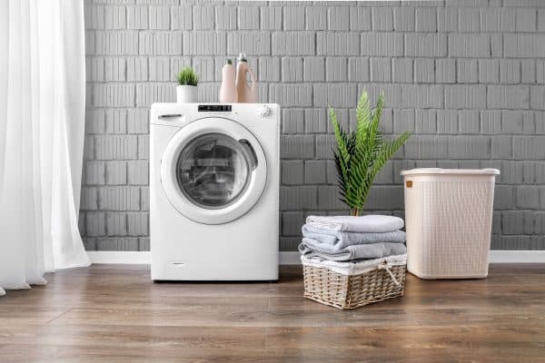 Clothes washing machine in laundry room interior with window. - 17 Curtain Ideas For The Laundry Room That You Should Try!
