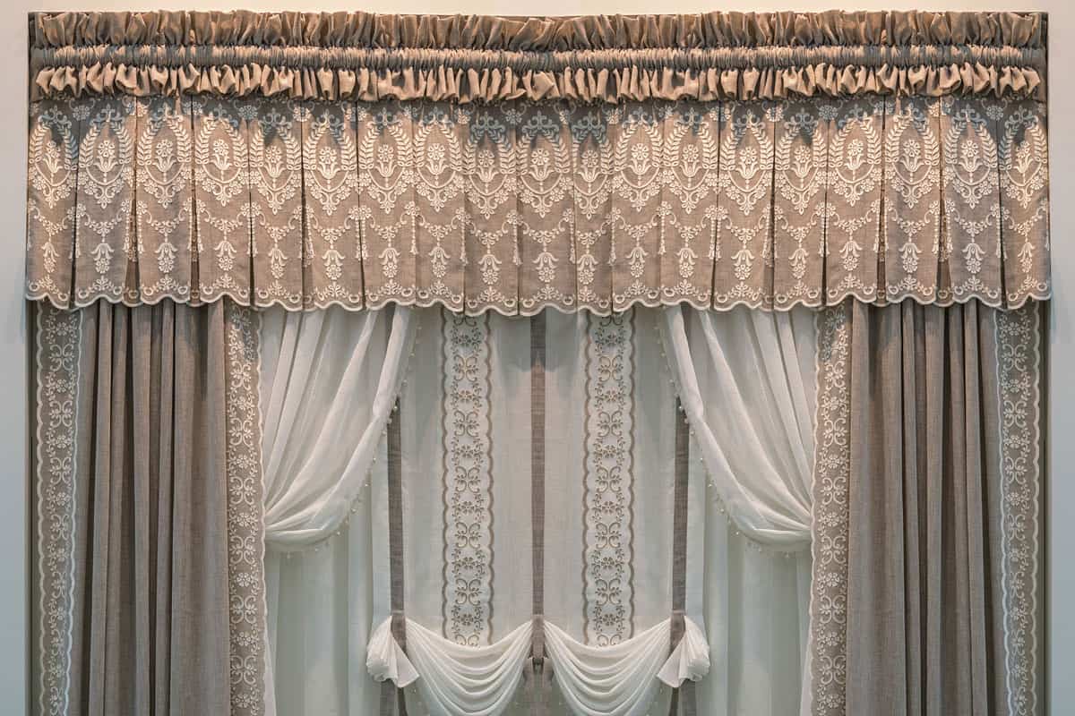 Decoration of windows with linen cloth in gentle pastel colors