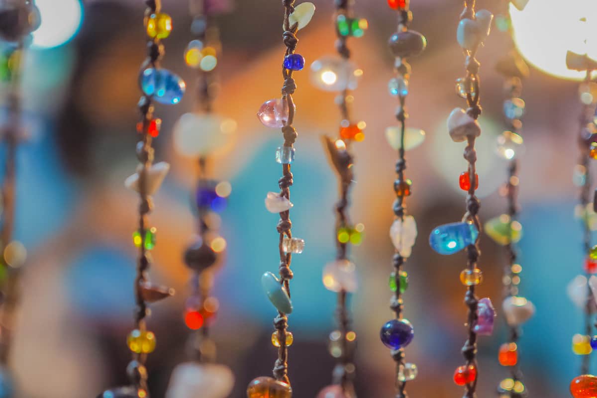 Shiny colorful blurred beaded curtain in retro style by night