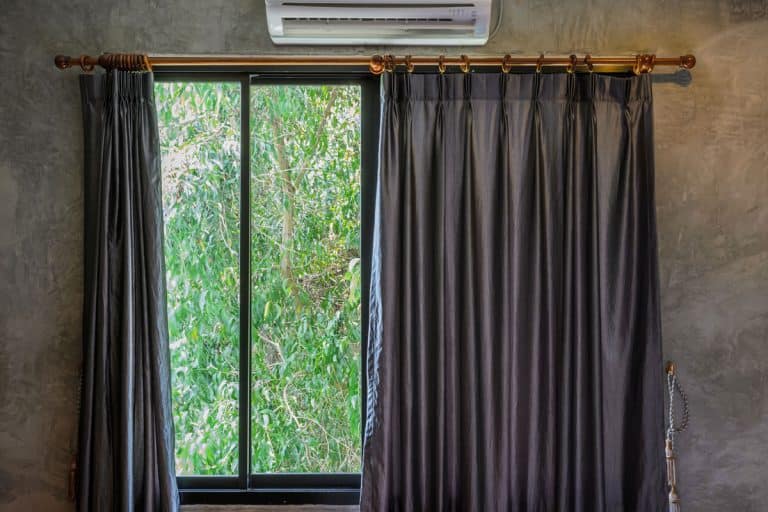 Window glass with ac on top of the curtain, How To Hang Curtains Around An Air Conditioner [Inc. Window Ac]