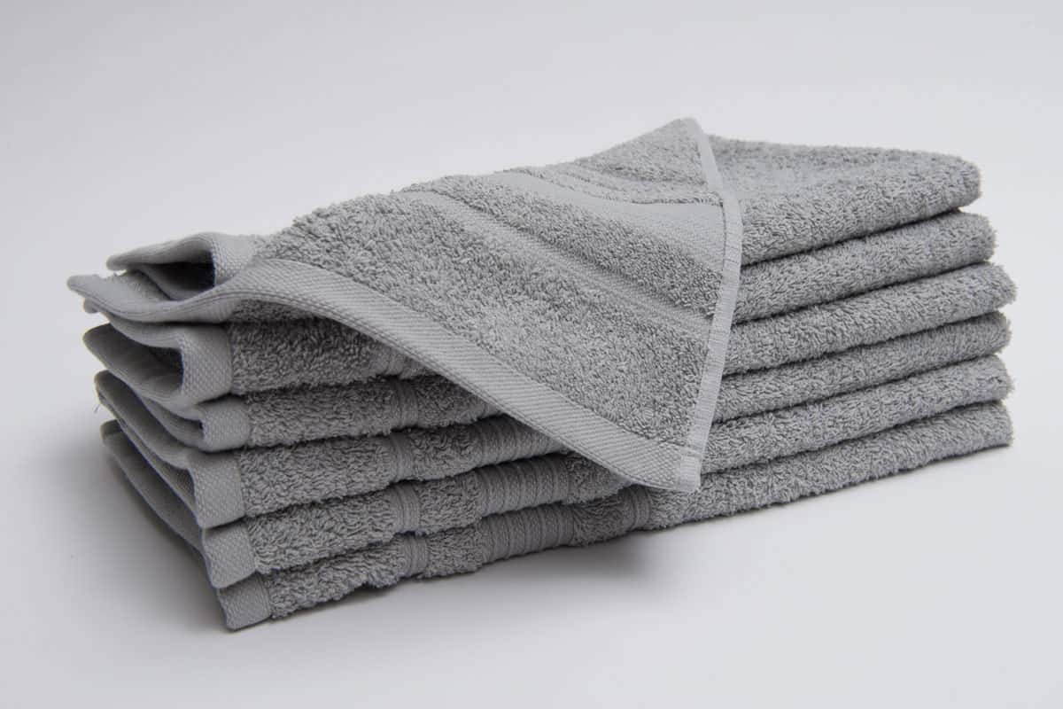 Six sheets of grey folded towels